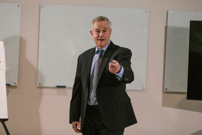 Professional presenter delivering a business talk in a conference room.